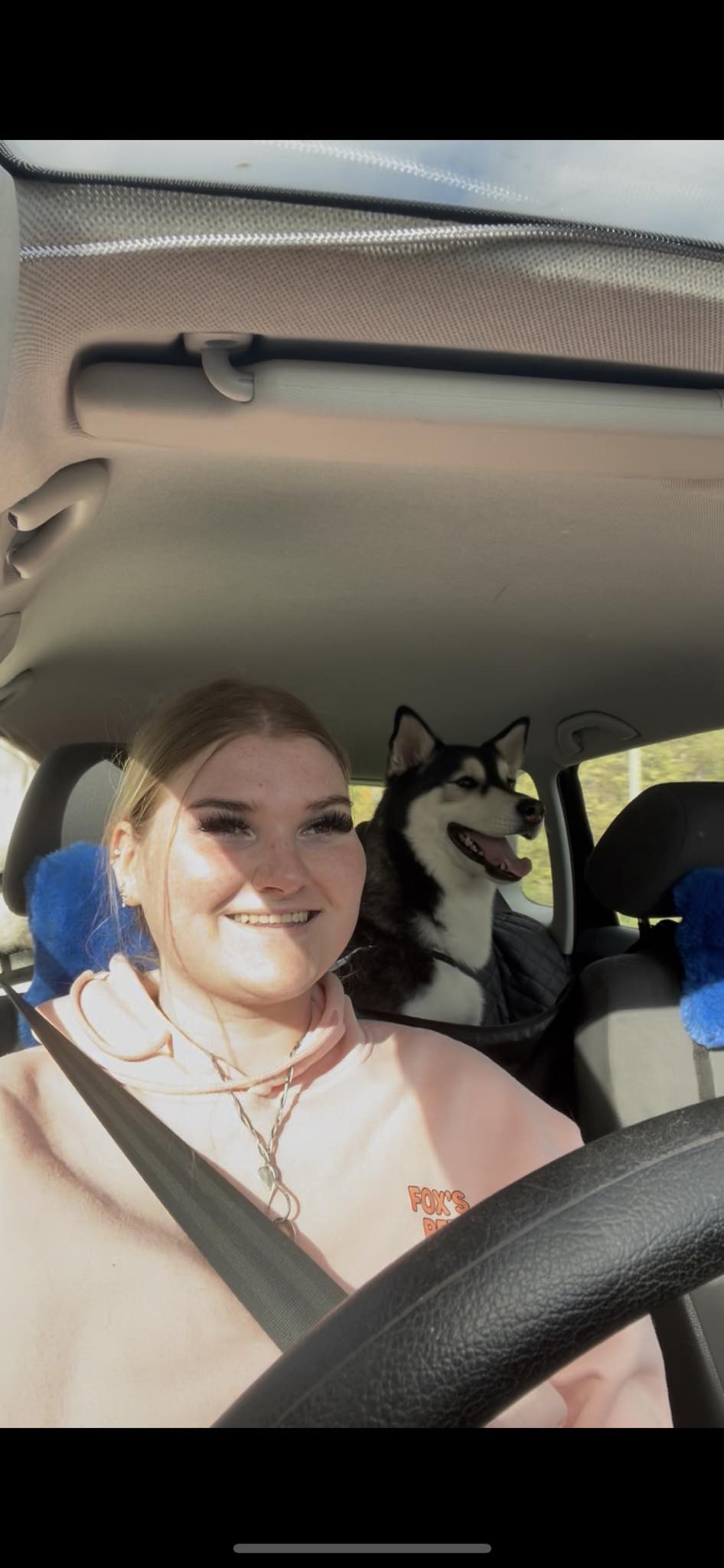 Emma and moon in car